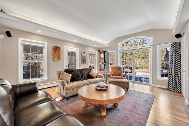 9 Anton Ln, Berlin, CT 06037 - living area featuring a baseboard radiator, vaulted ceiling, recessed lighting, and light wood-type flooring