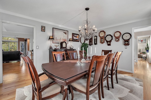 9 Anton Ln, Berlin, CT 06037 - dining area with a chandelier, light wood-style floors, and crown molding