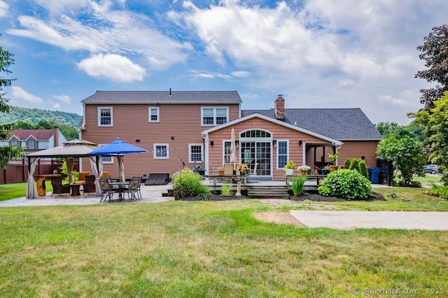 9 Anton Ln, Berlin, CT 06037 - rear view of house with a gazebo, a patio area, a chimney, a deck, and a lawn