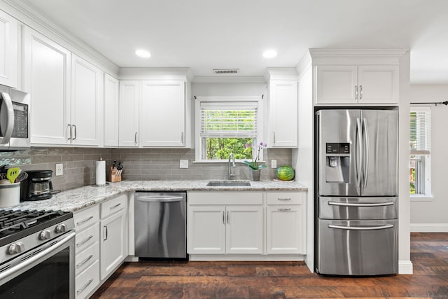306 Hadley Dr Unit 306, Trumbull, CT 06611 - kitchen with stainless steel appliances, white cabinets, dark wood-style floors, tasteful backsplash, and recessed lighting