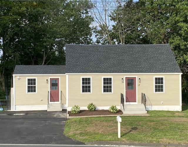13 Brushy Plain Rd, Branford, CT 06405 - new england style home featuring a front yard, a shingled roof, and entry steps