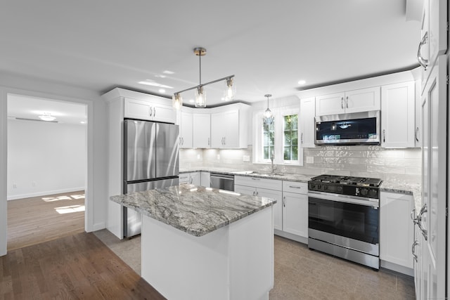 13 Brushy Plain Rd, Branford, CT 06405 - kitchen with appliances with stainless steel finishes, tasteful backsplash, white cabinets, light stone countertops, and recessed lighting