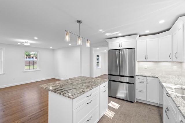 13 Brushy Plain Rd, Branford, CT 06405 - kitchen featuring stainless steel fridge, recessed lighting, white cabinetry, light stone countertops, and decorative backsplash