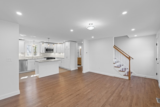 13 Brushy Plain Rd, Branford, CT 06405 - unfurnished living room featuring light wood finished floors, recessed lighting, and stairway