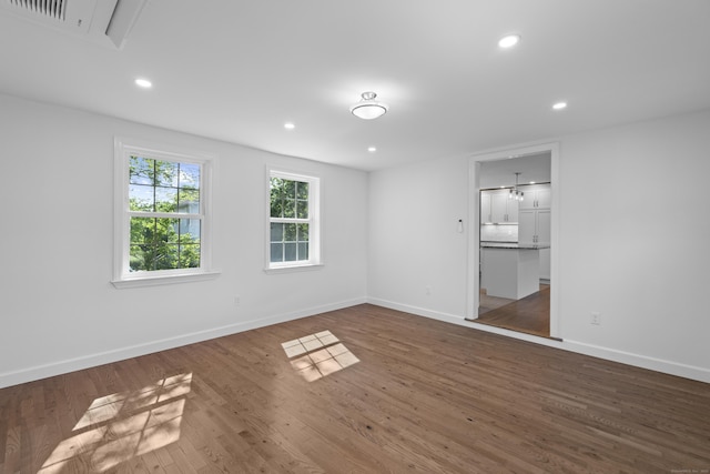 13 Brushy Plain Rd, Branford, CT 06405 - empty room with wood finished floors, recessed lighting, and attic access