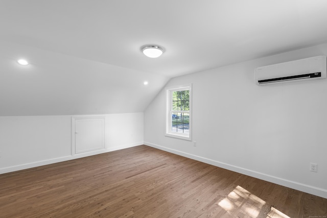 13 Brushy Plain Rd, Branford, CT 06405 - bonus room featuring an AC wall unit, wood finished floors, and lofted ceiling