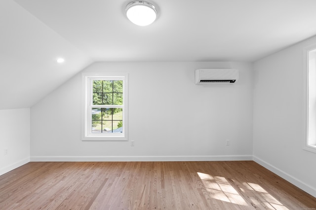 13 Brushy Plain Rd, Branford, CT 06405 - bonus room featuring a wall mounted air conditioner, lofted ceiling, and wood finished floors