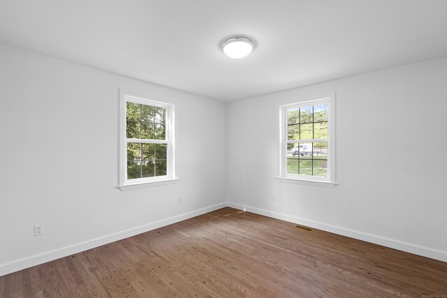 13 Brushy Plain Rd, Branford, CT 06405 - empty room featuring wood finished floors and baseboards