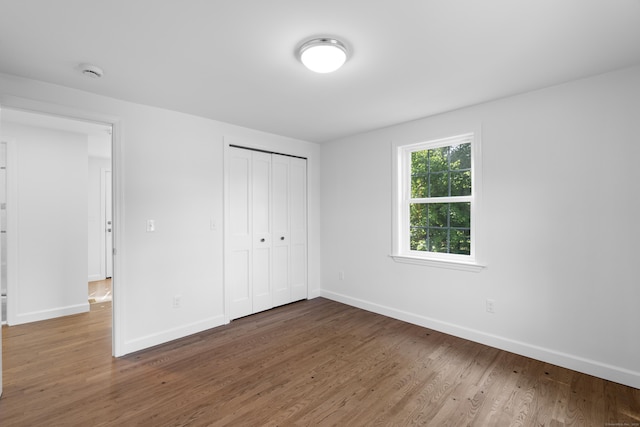 13 Brushy Plain Rd, Branford, CT 06405 - unfurnished bedroom with wood finished floors and a closet