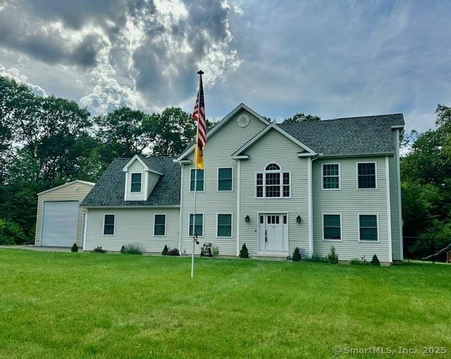 7 Pimlico Rd, Wolcott, CT 06716 - rear view of house with a lawn, a detached garage, and roof with shingles