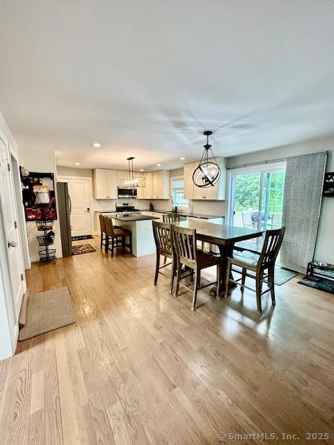 7 Pimlico Rd, Wolcott, CT 06716 - dining area with light wood-type flooring and recessed lighting