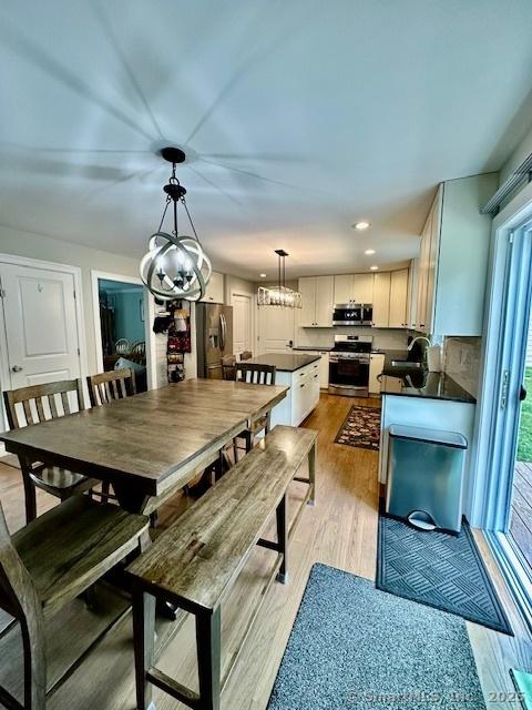 7 Pimlico Rd, Wolcott, CT 06716 - dining area featuring a chandelier, light wood-style flooring, and recessed lighting
