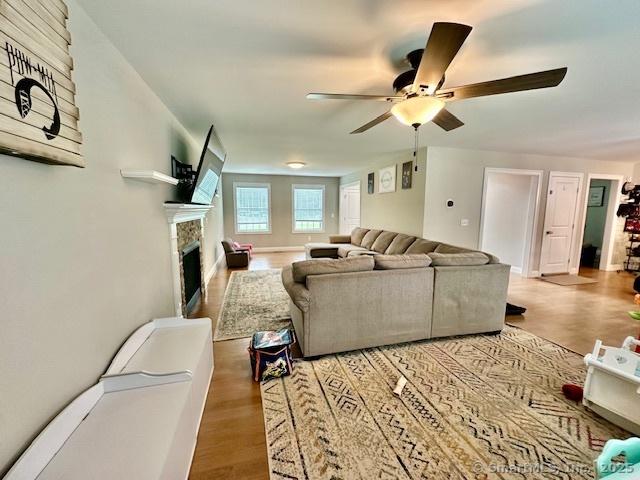 7 Pimlico Rd, Wolcott, CT 06716 - living room featuring a ceiling fan, wood finished floors, and a fireplace
