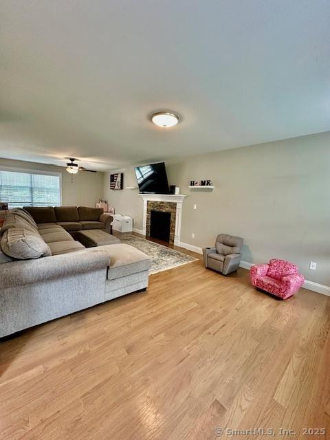 7 Pimlico Rd, Wolcott, CT 06716 - living area featuring a fireplace and wood finished floors