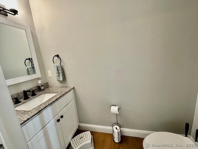 7 Pimlico Rd, Wolcott, CT 06716 - half bath with vanity and wood finished floors