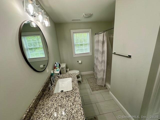 7 Pimlico Rd, Wolcott, CT 06716 - bathroom with healthy amount of natural light, vanity, and a shower with curtain