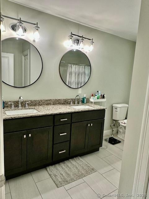 7 Pimlico Rd, Wolcott, CT 06716 - bathroom with double vanity and tile patterned floors