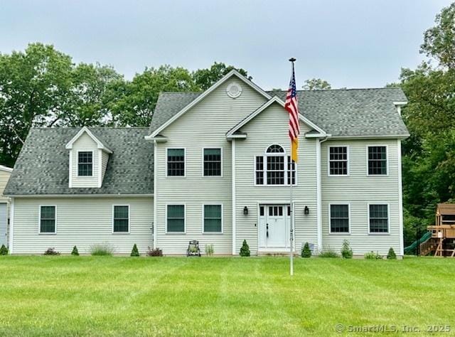 7 Pimlico Rd, Wolcott, CT 06716 - rear view of property featuring a playground, a yard, and roof with shingles