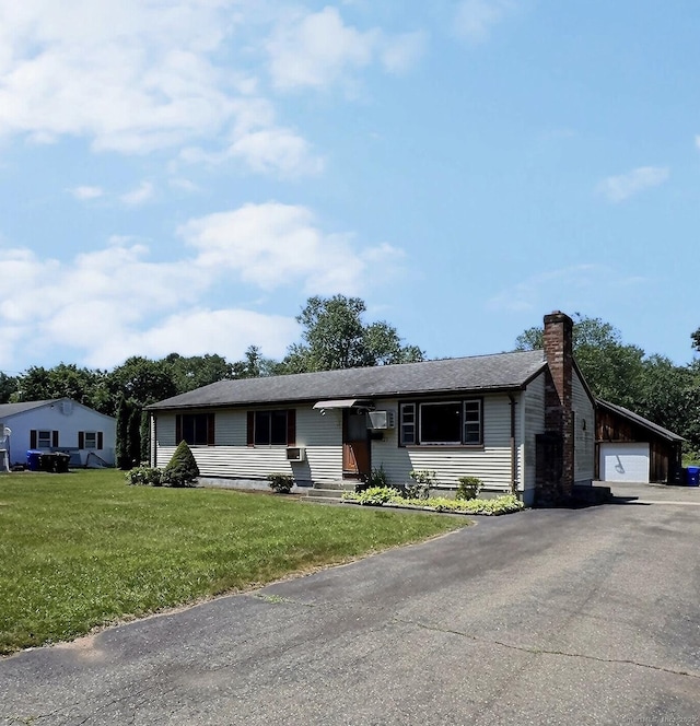 23 Westerly Dr, Enfield, CT 06082 - ranch-style home featuring a chimney, a front lawn, a garage, and a wall mounted AC