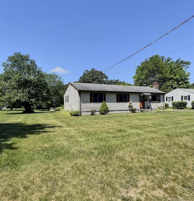 23 Westerly Dr, Enfield, CT 06082 - rear view of property featuring a lawn