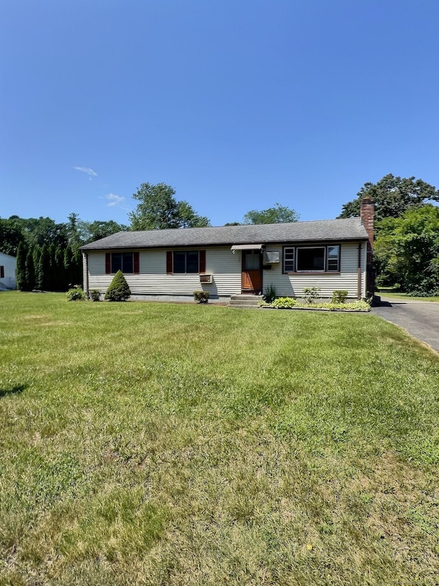 23 Westerly Dr, Enfield, CT 06082 - single story home featuring a chimney, a front yard, and entry steps