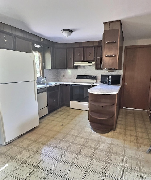 23 Westerly Dr, Enfield, CT 06082 - kitchen with white appliances, under cabinet range hood, light floors, light countertops, and dark brown cabinets