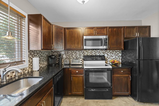 827 Oronoke Rd Apt 5-6, Waterbury, CT 06708 - kitchen featuring black appliances, plenty of natural light, dark stone countertops, and backsplash
