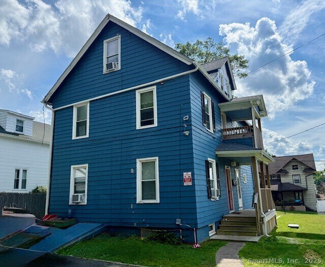 72 Stewart St, Bristol, CT 06010 - view of home's exterior with a balcony and cooling unit