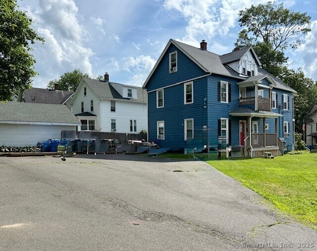 72 Stewart St, Bristol, CT 06010 - multi unit property featuring a front yard and a balcony