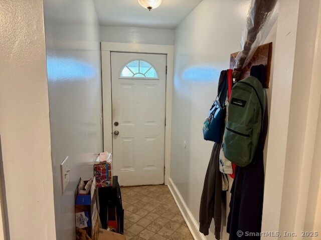 72 Stewart St, Bristol, CT 06010 - doorway featuring baseboards and tile patterned floors