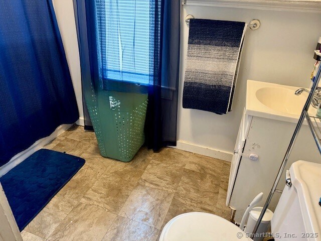 72 Stewart St, Bristol, CT 06010 - bathroom featuring vanity and crown molding