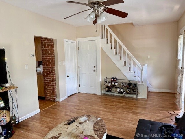 72 Stewart St, Bristol, CT 06010 - living room featuring ceiling fan, stairs, and wood finished floors