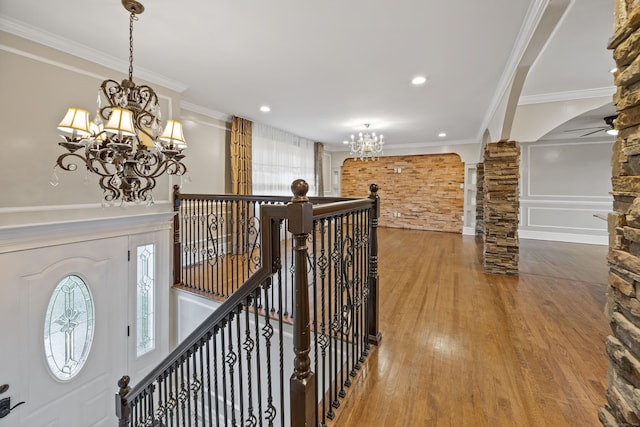 90 Haddad Rd, Waterbury, CT 06708 - foyer featuring a chandelier, wood finished floors, decorative columns, ornamental molding, and recessed lighting