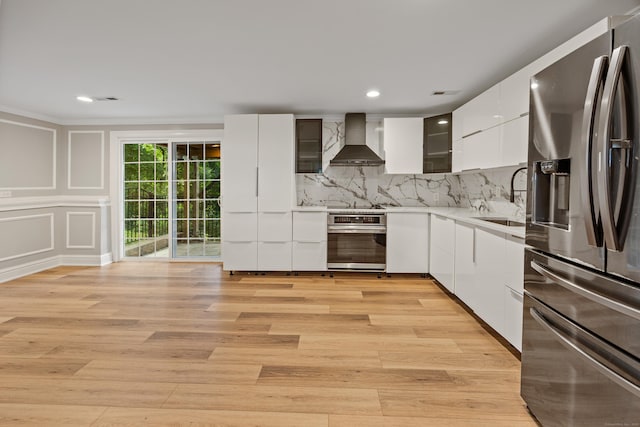 90 Haddad Rd, Waterbury, CT 06708 - kitchen featuring appliances with stainless steel finishes, wall chimney exhaust hood, modern cabinets, white cabinetry, and recessed lighting