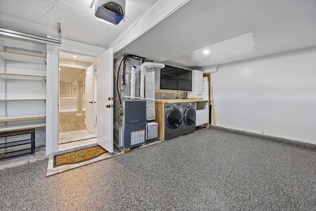 90 Haddad Rd, Waterbury, CT 06708 - garage with a garage door opener, washer and clothes dryer, heating unit, and recessed lighting