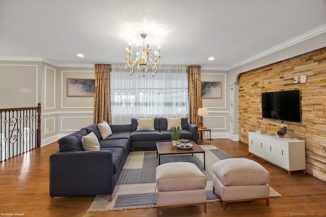 90 Haddad Rd, Waterbury, CT 06708 - living area with a decorative wall, crown molding, a chandelier, wood finished floors, and recessed lighting