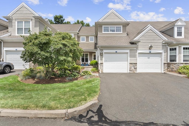 47 Bradford Walk Unit 47, Farmington, CT 06032 - multi unit property with driveway, stone siding, a shingled roof, a garage, and a front yard