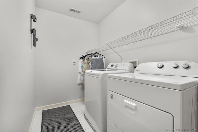 47 Bradford Walk Unit 47, Farmington, CT 06032 - washroom with independent washer and dryer and light tile patterned floors