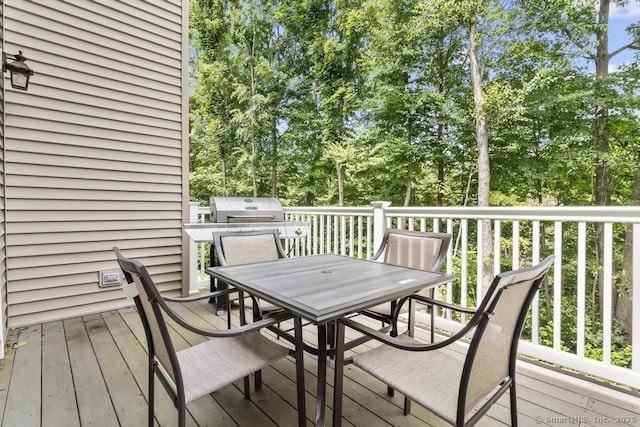 47 Bradford Walk Unit 47, Farmington, CT 06032 - wooden terrace featuring outdoor dining space, view of wooded area, and a grill