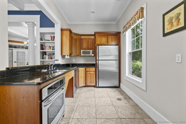 47 Bradford Walk Unit 47, Farmington, CT 06032 - kitchen with appliances with stainless steel finishes, plenty of natural light, light marble finish flooring, brown cabinets, and ornamental molding