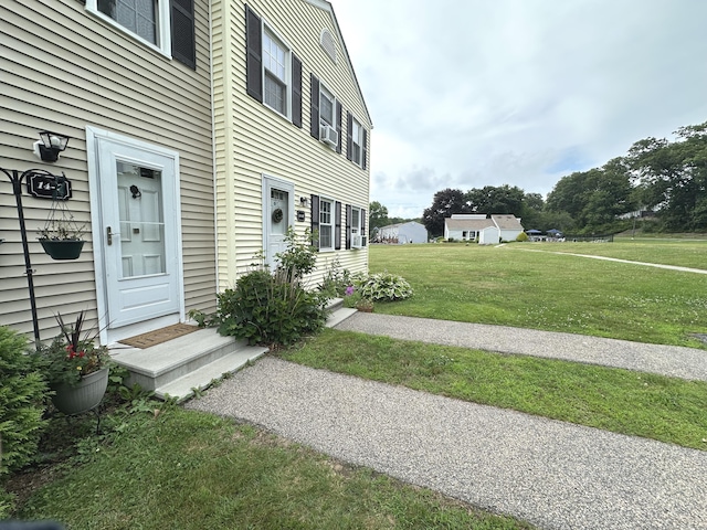 14 Lakeside Dr Unit Q, Ledyard, CT 06339 - view of exterior entry with a yard