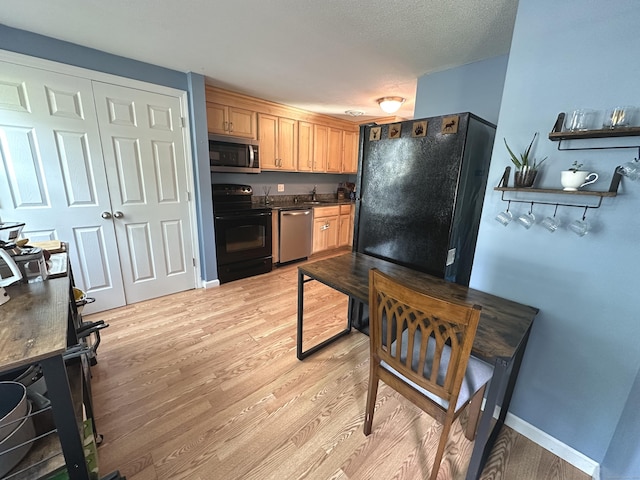 14 Lakeside Dr Unit Q, Ledyard, CT 06339 - kitchen featuring black appliances, light wood-style floors, and dark countertops