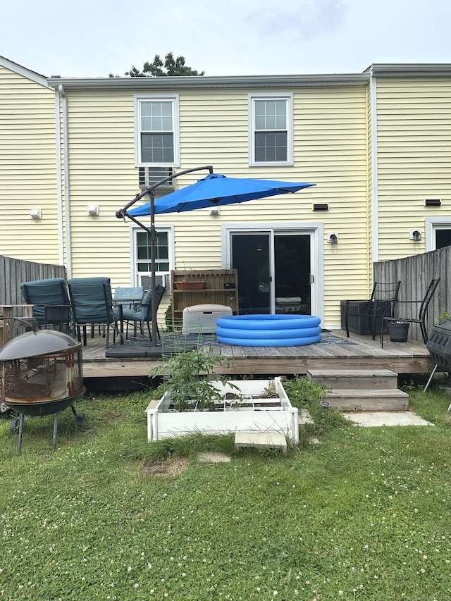 14 Lakeside Dr Unit Q, Ledyard, CT 06339 - back of property featuring a deck and a lawn