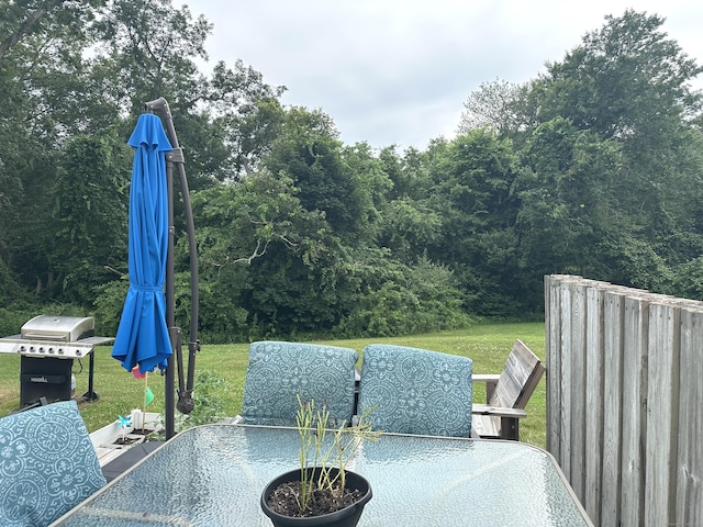 14 Lakeside Dr Unit Q, Ledyard, CT 06339 - view of patio featuring outdoor dining space, area for grilling, and a view of trees