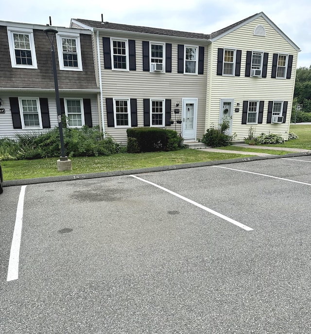 14 Lakeside Dr Unit Q, Ledyard, CT 06339 - view of property featuring uncovered parking