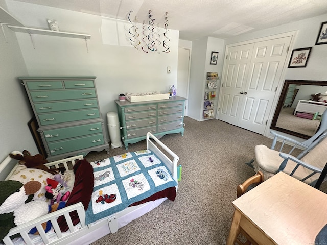 14 Lakeside Dr Unit Q, Ledyard, CT 06339 - bedroom featuring a closet and dark colored carpet
