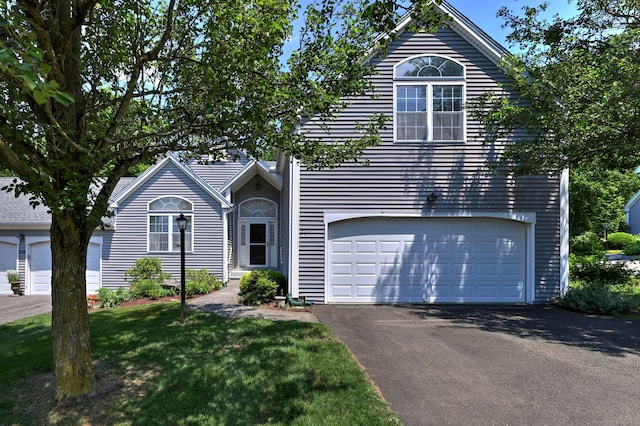 507 Elk Run Unit 507, Shelton, CT 06484 - view of front facade featuring driveway, a garage, and a front lawn