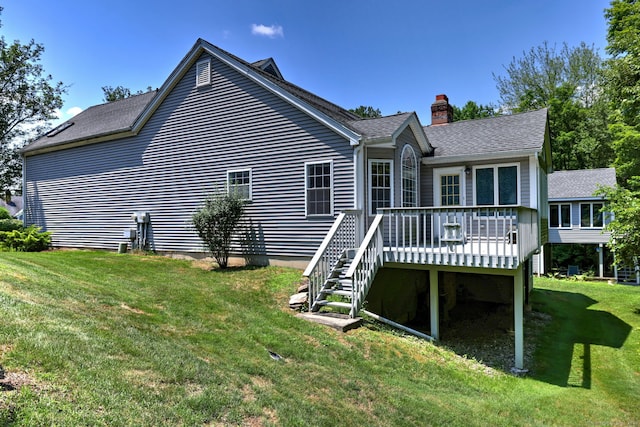 507 Elk Run Unit 507, Shelton, CT 06484 - back of house featuring a wooden deck, a chimney, a yard, and roof with shingles
