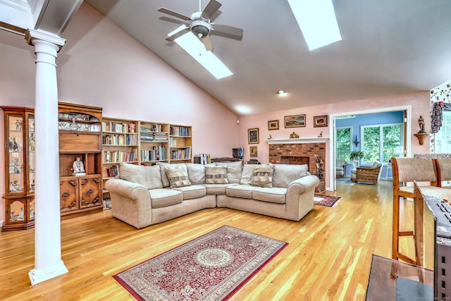 507 Elk Run Unit 507, Shelton, CT 06484 - living room with a skylight, ornate columns, high vaulted ceiling, ceiling fan, and light wood finished floors