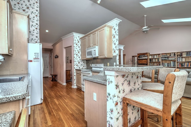 507 Elk Run Unit 507, Shelton, CT 06484 - kitchen featuring white appliances, a skylight, ceiling fan, light wood-style flooring, and a peninsula